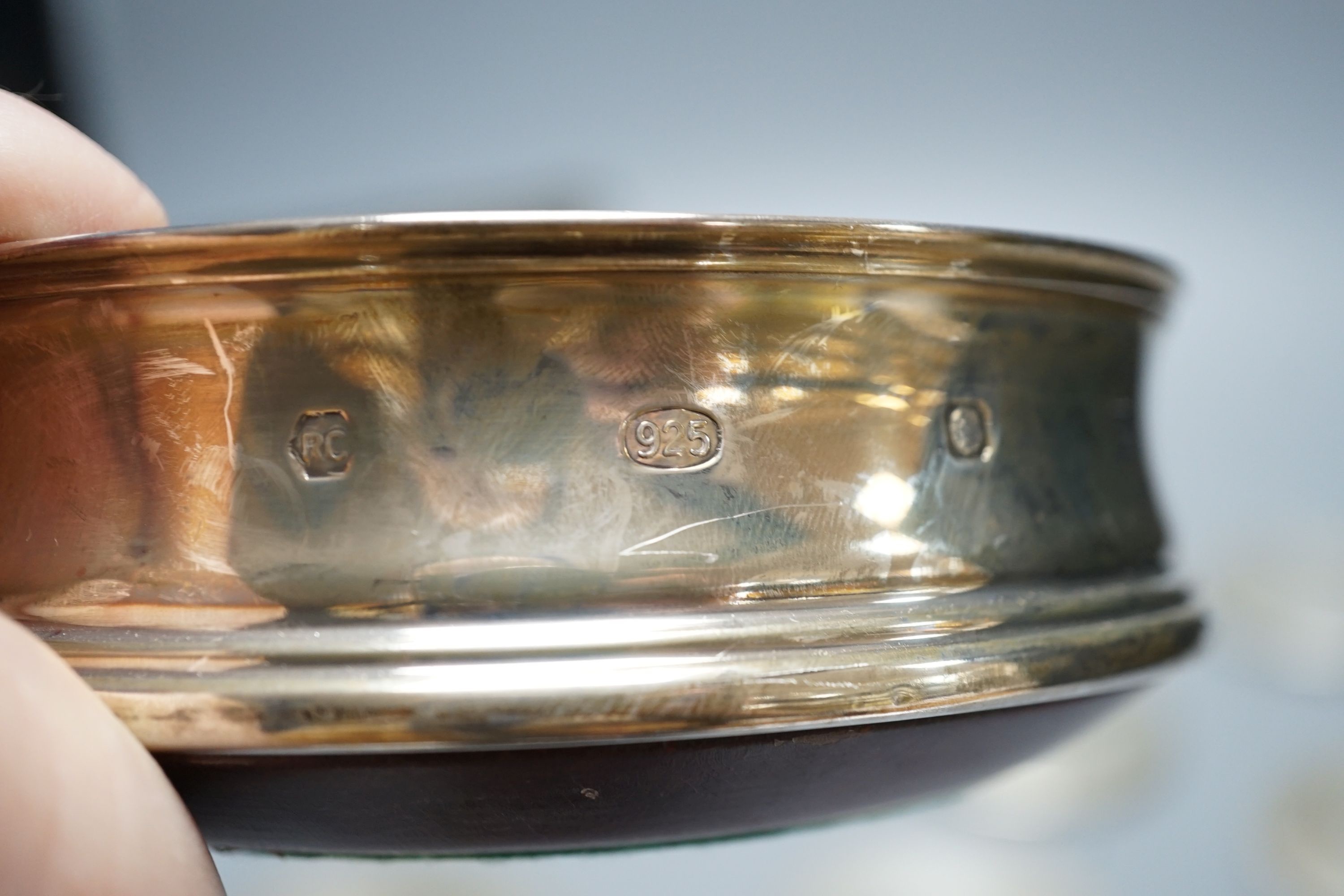 A cased set of six German 800 standard teaspoons by Robbe & Berking, a set of six silver mounted glass coaster and a modern silver mounted wine coaster.